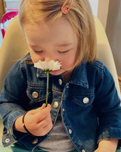Load image into Gallery viewer, baby girl smelling flower 
