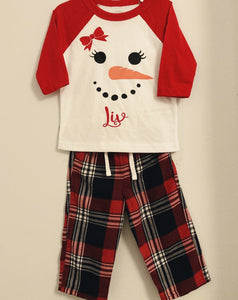 Red top with personalised snowman and red check pants 