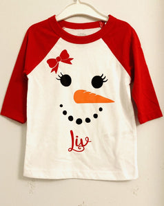 red  top with personalised snowman and red check pants 