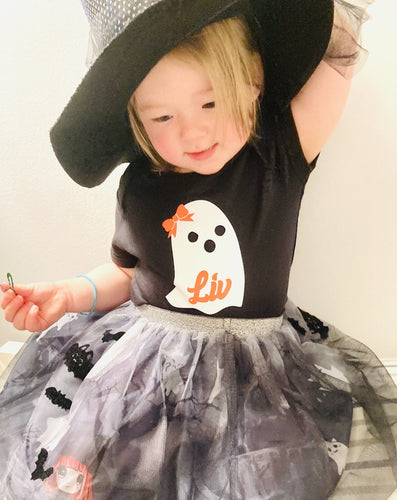 Toddler dressed as a witch 