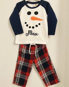 Navy top with personalised snowman and red check pants 